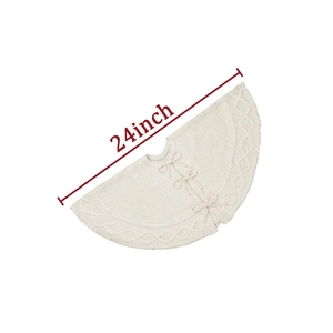 Detailed view of 24-inch white knitted Christmas tree skirt with bow ties and cable patterns