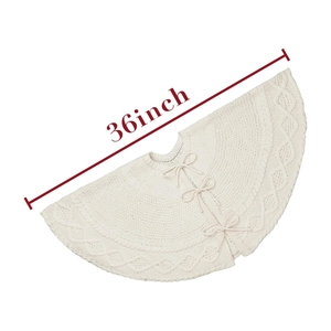 Detailed view of a 36-inch white knit Christmas tree skirt with cable knit patterns