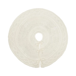 White knitted Christmas tree skirt with cable stitch patterns and bow tie closures