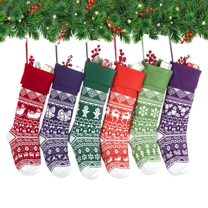 Set of 6 colorful knitted Christmas stockings with reindeer and snowflake patterns
