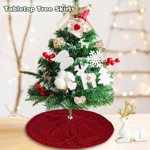 Red chunky knit tabletop Christmas tree skirt with cable knit pattern and tie closure