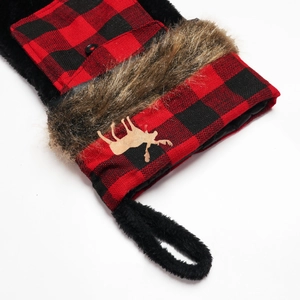 Red and black buffalo plaid Christmas stocking with reindeer patch and faux fur trim