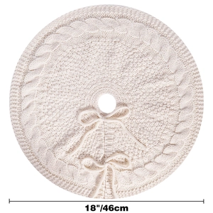Detail of 18 inch cream white knit Christmas tree skirt with classic cable patterns
