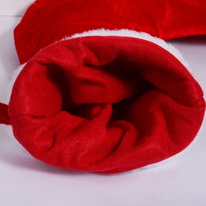 Close-up of classic red Christmas stocking with white faux fur trim and interior detail
