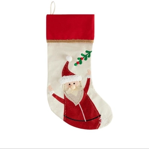 Classic Christmas stocking with red cuff and Santa Claus applique embroidery decoration