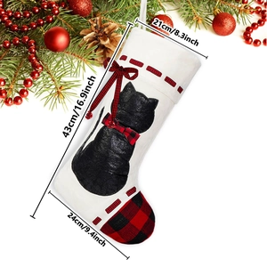 Christmas stocking featuring black cat silhouette with red buffalo plaid trim and size info