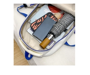 Spacious interior of white backpack showing storage for tablets, books and gadgets