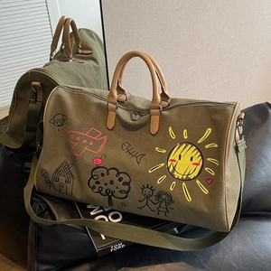 Olive green large canvas travel bag with leather straps and playful child-style drawings