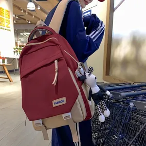 Sac à dos bordeaux minimaliste de grande capacité avec écusson mode et pendentif chien peluche