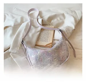 Detail of multi-color jacquard fabric hobo bag with adjustable lavender strap