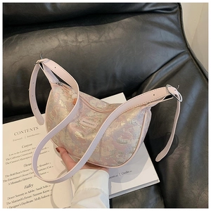 Detail of pink marble pattern crescent bag with adjustable leather strap and silver ring