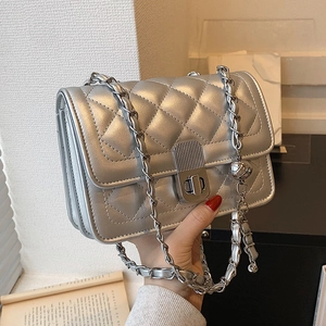 Silver quilted chain square bag with metallic finish and adjustable metal ball pendant