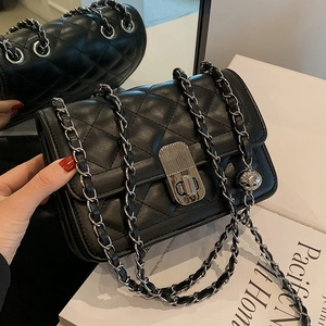 Quilted black chain crossbody bag with silver clasp and premium leather finish