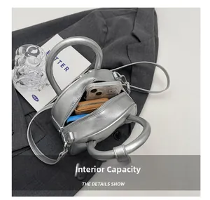Top view of silver square crossbody bag interior showing spacious storage for essentials