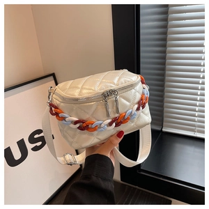 Close-up of pearl white quilted crossbody bag with colorful chunky chain detail