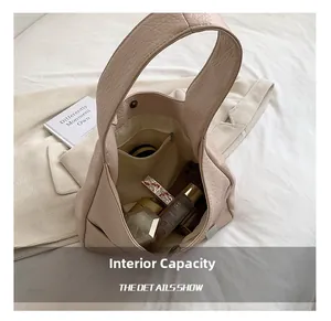 Internal view showing large capacity and zipper pocket of the pink tote bag