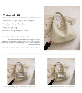 Detailed view of cream PU hobo bag texture and dimensions showing A4 magazine capacity
