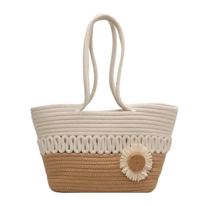Woven straw tote bag in beige and brown colorblock with a decorative side flower