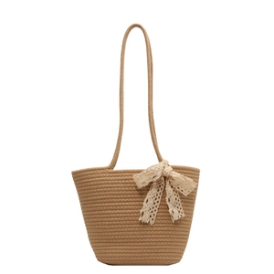 Minimalist brown woven shoulder bag for women featuring a delicate white lace bow accent