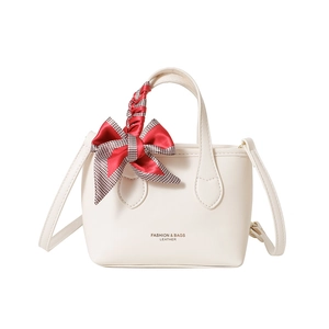 Chic cream leather mini bucket bag with checkered bow accent and adjustable strap