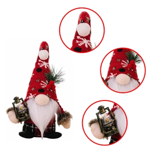 Detail of Christmas gnome figurine with snowflake hat, pine needles and vintage lantern