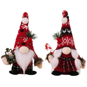 Set of two plush Christmas gnomes with knit hats, kerosene lamp, and candy cane props