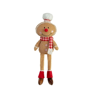 Gingerbread man plush doll with chef hat and red checkered scarf on white background