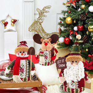 Detailed plush Christmas figurines set of Santa, snowman and elk in a festive home setting