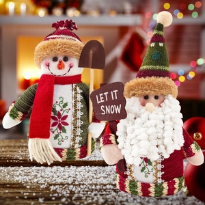 Christmas plush dolls set featuring Snowman and Santa Claus on snow-covered wood