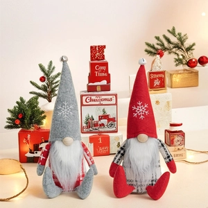 Detail of Christmas gnomes plush set with snowflake embroidery and checkered clothes