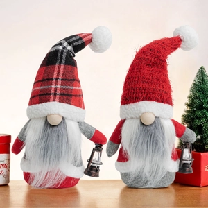Pair of Christmas Rudolf gnomes with plaid hats and decorative vintage lanterns