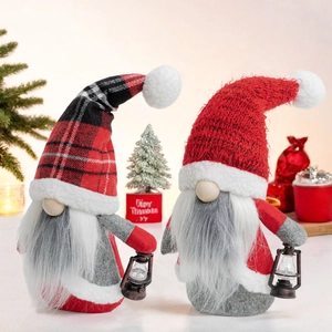Set of two Christmas gnomes with plaid hats and decorative lanterns for home holiday decor