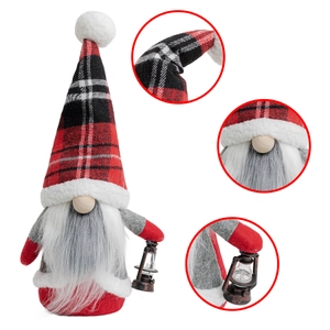 Detail of Christmas gnome with red plaid hat, grey beard and vintage micro lantern
