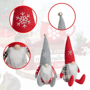 Detail of Christmas gnome with snowflake embroidery, metal bell, and artificial beard