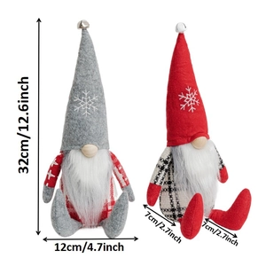 Detailed view of Christmas gnomes with snowflake embroidery and silver bells on top