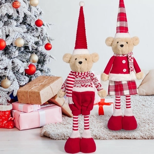Set of two Christmas plush bears in red sweaters and hats with striped legs and boots
