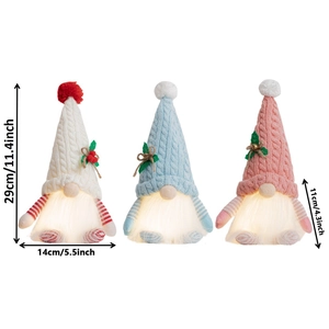 Three glowing Christmas gnomes with knitted hats and warm LED lights for festive decor