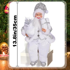 Detailed view of 13.8in sitting Santa doll on gift boxes with silver glitter accents
