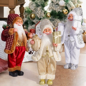 Detailed close-up of three 18-inch Santa Claus dolls in red plaid, gold and silver outfits