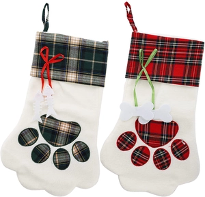 Detail of Christmas pet stockings with plaid fish and bone charms and paw prints