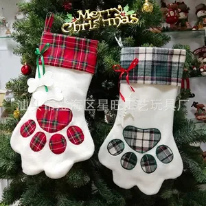 Classic red and green plaid pet paw Christmas stockings with bone charms and bow knots
