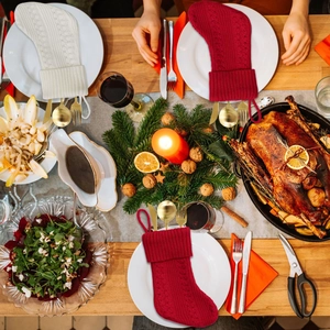 Festive knitted Christmas stocking cutlery holders set with cable knit texture for table décor