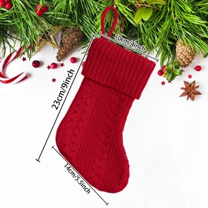 Close-up of red chunky knit Christmas stocking with hanging loop and size dimensions