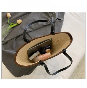 Detail showing the large capacity interior of the woven tote bag with daily essentials