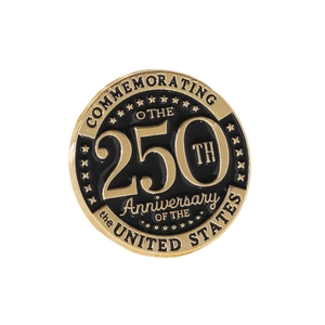 Detailed macro shot of the US 250th Anniversary gold and black metal commemorative pin badge.
