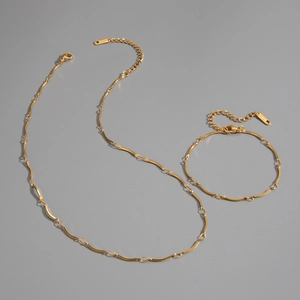Detailed close-up view of minimalist 18K gold plated stainless steel jewelry set