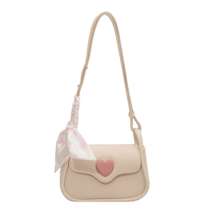 Cream vintage crossbody bag with pink heart leather detail and decorative floral scarf