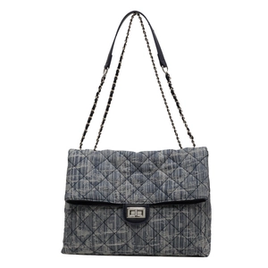 Blue denim tweed crossbody bag with quilted diamond pattern and silver chain strap