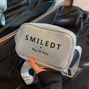 Silver metallic square crossbody bag with wide strap and SMILEDT brand logo print
