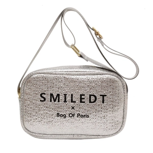 Silver camera crossbody bag with crackle texture and adjustable strap on white background
